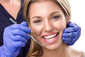 Woman smiling at cosmetic dentist in Pikesville, MD