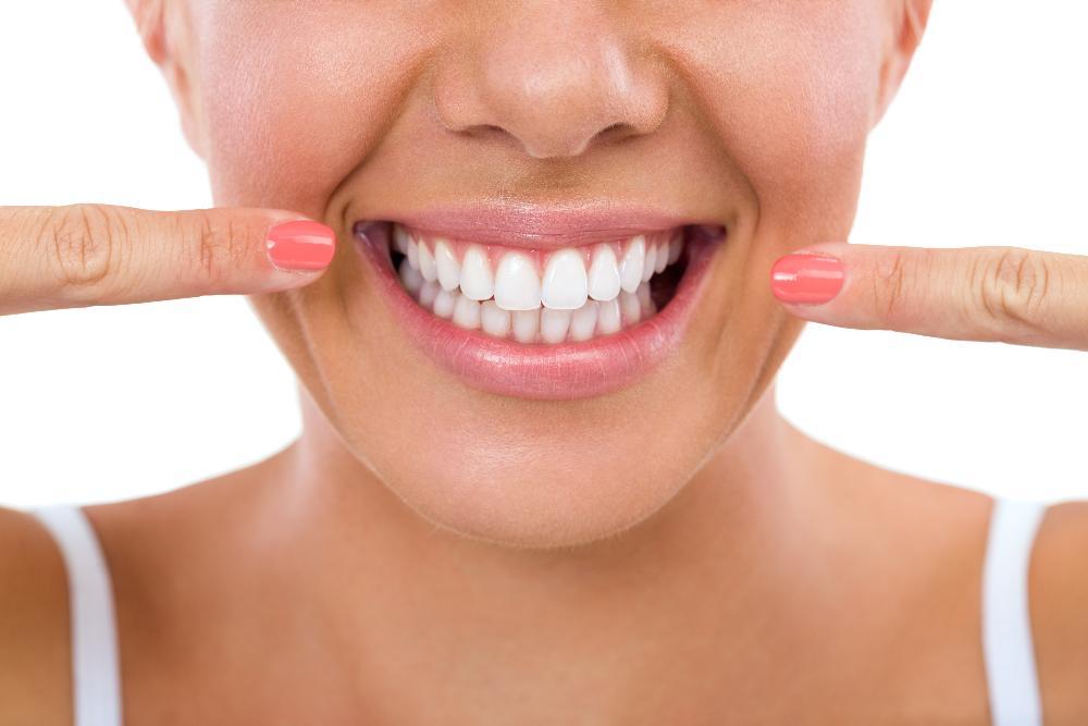Woman shows off her teeth after professional whitening in Pikesville, MD