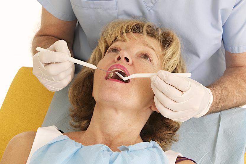 woman getting a dental exam l dentist pikesville md