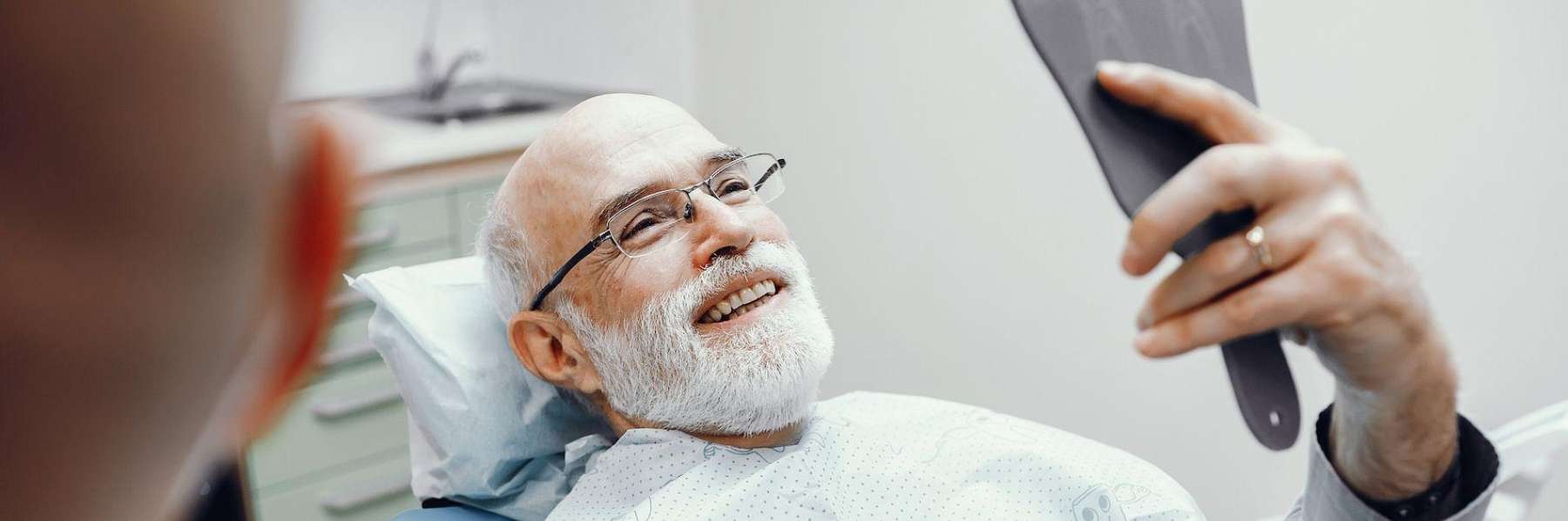 A man smiling after a Dental consultation in Pikesville, MD